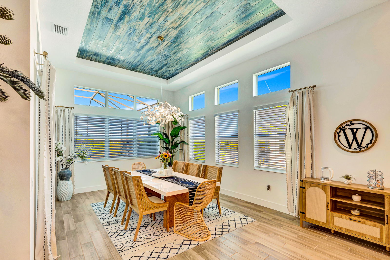 Custom wood ceiling and beam treatment in a dining room