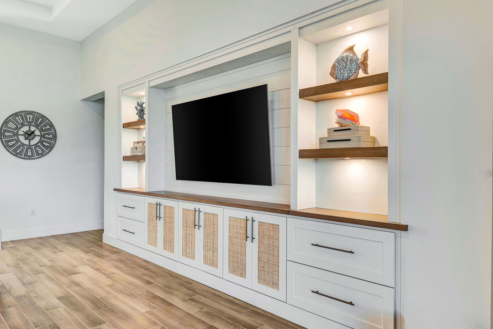 Custom entertainment center with substantial built-in cabinetry